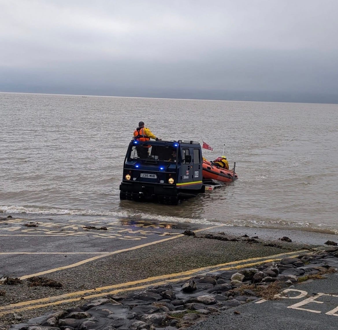 Two people and dog in tide rescue drama